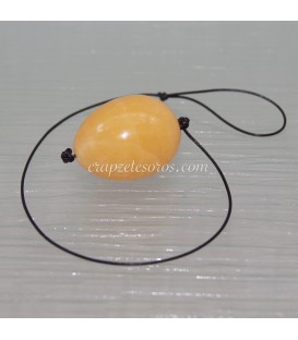 Calcita naranja talla huevo perforado para masajes