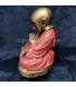 Buda niño meditando con rosario y cuenco