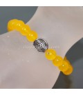Ágata amarilla en pulsera elástica con sello espiral evolucionista
